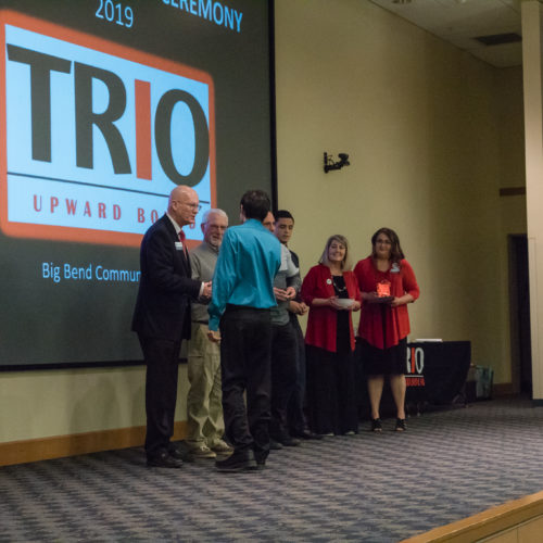 Students being congratulated TRIO member induction
