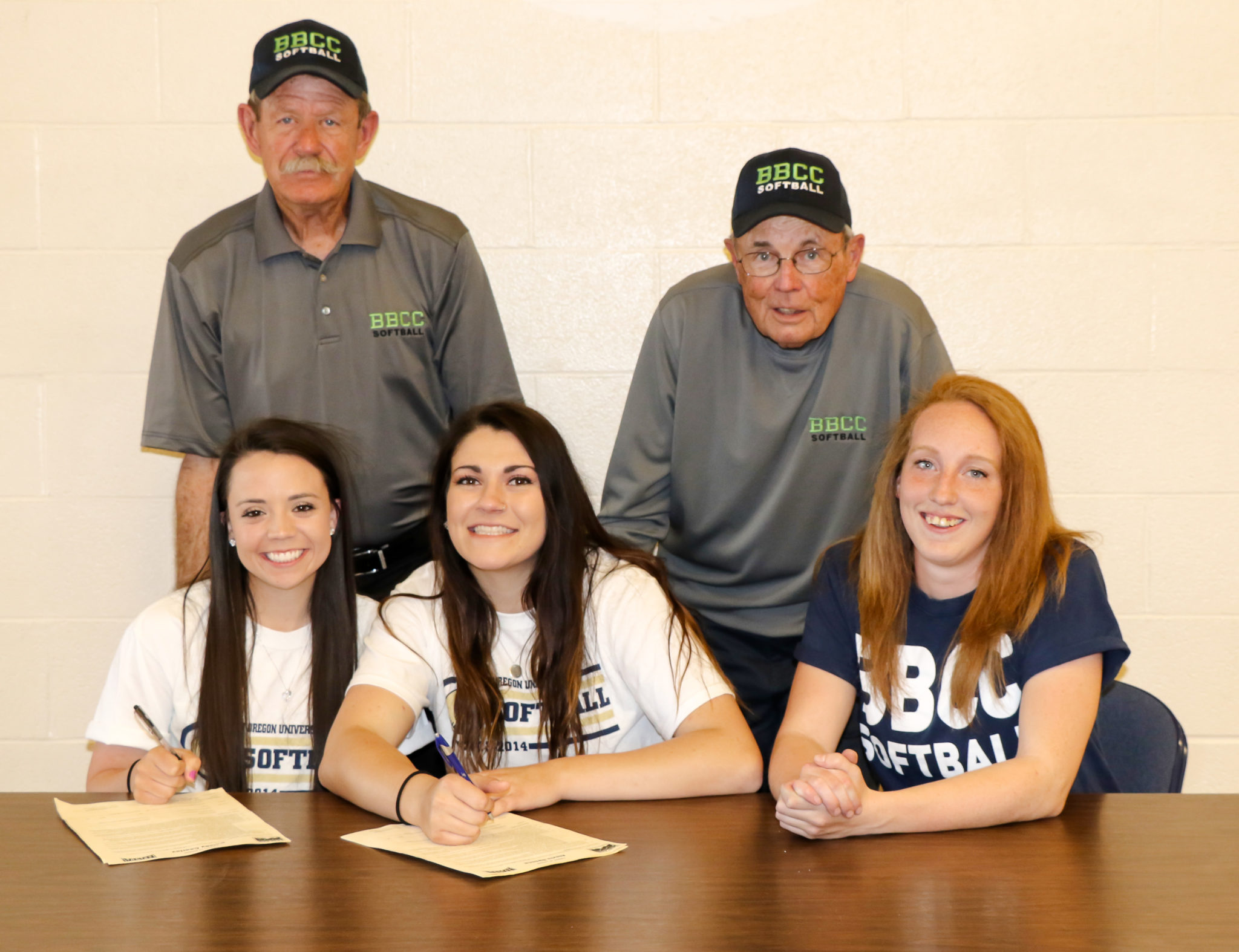 student softball players signing letters of intent