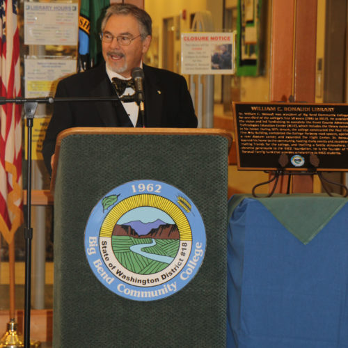 Bill Bonaudi gives a response to the dedication speakers. He is standing next to the bronze plaque that will be placed at the library entrance.