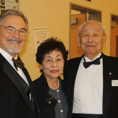 Bill is congratulated by Trustee Emeritus Paul Hiria and his wife Ginny. The Fine Arts Building was named for Paul last year. Paul also was a Trustee when Bill was hired.