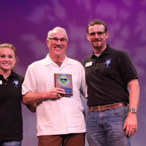 Teacher and students at outstanding student recognition event