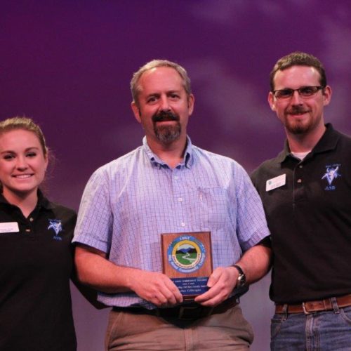 Teacher and student at outstanding students recognition event