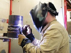 Welding student in lab