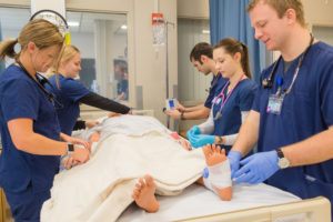 Nurses and doctors working on a simulation mannequin
