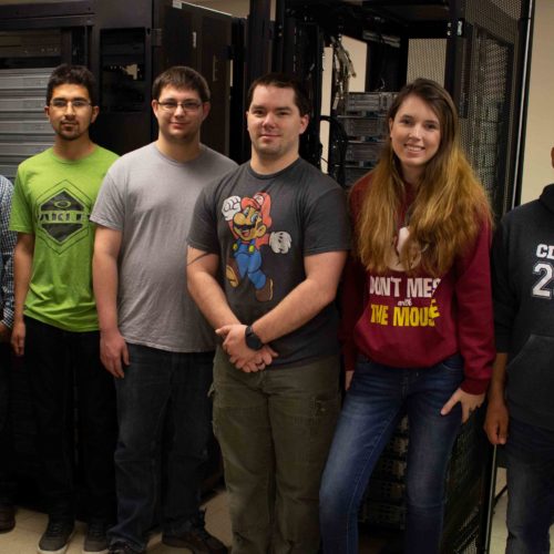 Students standing by servers donated by Microsoft