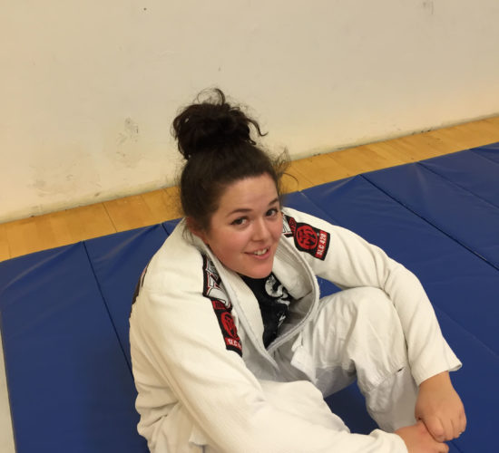 Jiu-Jitsu club member on mats