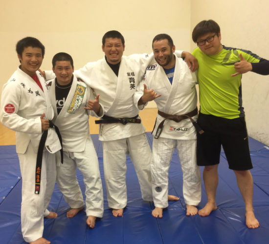 Jiu-Jitsu club members on mats