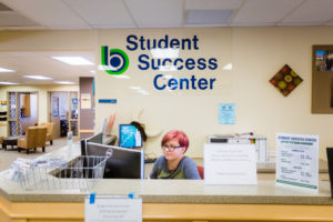 female student at welcome center