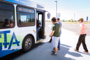 students waiting at bus stop