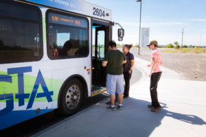 students getting on bus