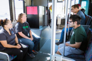 students riding bus